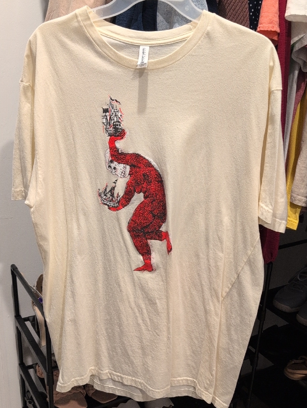 BILLY WOODS Cream Graphic Tee with Red Monster Ship Design